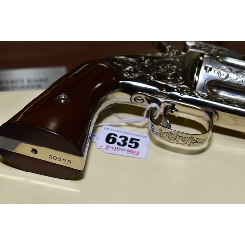 A BOXED FRANKLIN MINT WYATT EARP .44 REVOLVER, on a wooden display