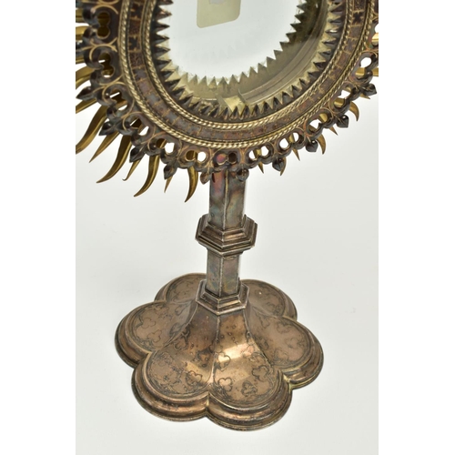 103 - A LATE 19TH/EARLY 20TH CENTURY ECCLESIASTICAL SILVER PLATED AND GILT METAL MONSTRANCE, radiating sun... 