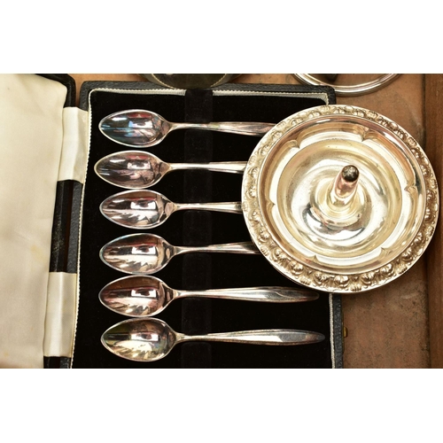 105 - A SELECTION OF WHITE METALWARE, to include an EP circular tray, a wavy edge raised silver plate tray... 