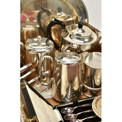 105 - A SELECTION OF WHITE METALWARE, to include an EP circular tray, a wavy edge raised silver plate tray... 