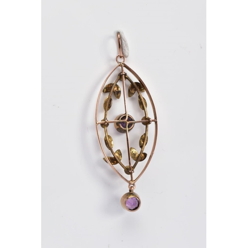 11 - AN EDWARDIAN OPENWORK PENDANT, the rose gold coloured pendant of oval form, set with a central circu... 