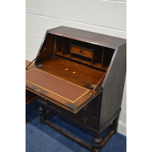 1291 - A MID 20TH CENTURY OAK BUREAU, together with a hardwood coffee table (2)