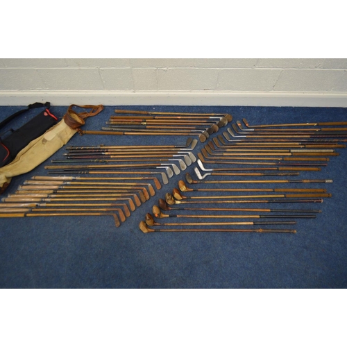 1292 - A LARGE COLLECTION OF VINTAGE HICKORY SHAFTED GOLF CLUBS, to include mainly irons, putters, woods, t... 