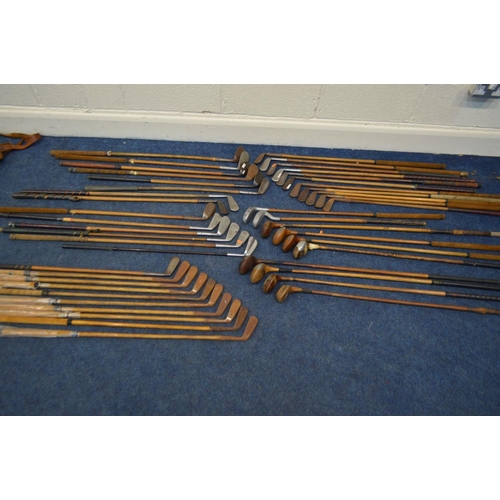 1292 - A LARGE COLLECTION OF VINTAGE HICKORY SHAFTED GOLF CLUBS, to include mainly irons, putters, woods, t... 