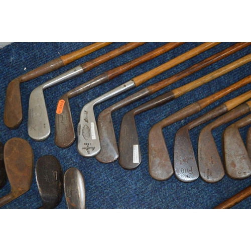 1292 - A LARGE COLLECTION OF VINTAGE HICKORY SHAFTED GOLF CLUBS, to include mainly irons, putters, woods, t... 