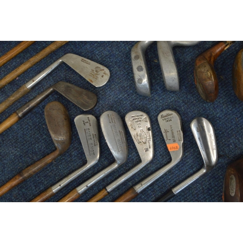 1292 - A LARGE COLLECTION OF VINTAGE HICKORY SHAFTED GOLF CLUBS, to include mainly irons, putters, woods, t... 