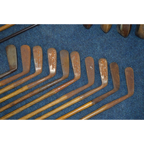 1292 - A LARGE COLLECTION OF VINTAGE HICKORY SHAFTED GOLF CLUBS, to include mainly irons, putters, woods, t... 