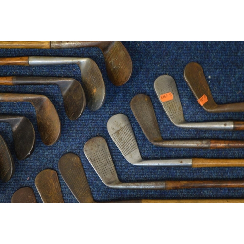 1292 - A LARGE COLLECTION OF VINTAGE HICKORY SHAFTED GOLF CLUBS, to include mainly irons, putters, woods, t... 