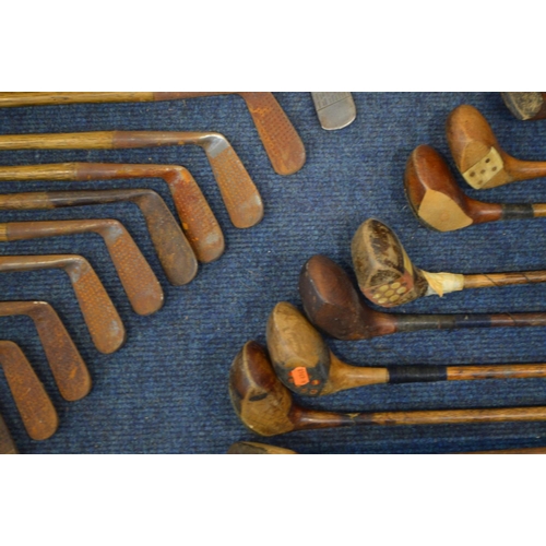 1292 - A LARGE COLLECTION OF VINTAGE HICKORY SHAFTED GOLF CLUBS, to include mainly irons, putters, woods, t... 