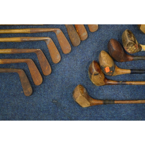 1292 - A LARGE COLLECTION OF VINTAGE HICKORY SHAFTED GOLF CLUBS, to include mainly irons, putters, woods, t... 