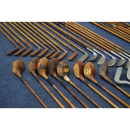 1292 - A LARGE COLLECTION OF VINTAGE HICKORY SHAFTED GOLF CLUBS, to include mainly irons, putters, woods, t... 