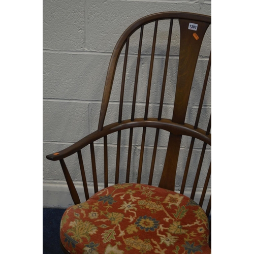 1303 - AN ERCOL GOLDEN DAWN ASH CHAIRMAKERS WINDSOR ROCKING CHAIR, on a crinoline stretcher, with a removab... 