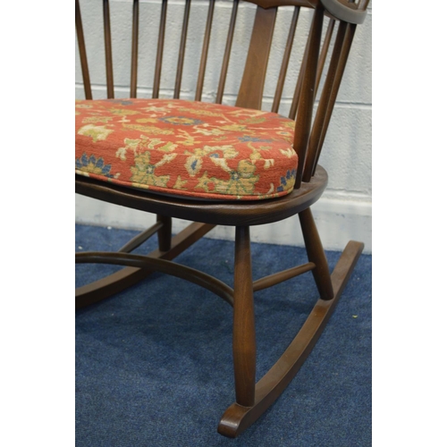 1303 - AN ERCOL GOLDEN DAWN ASH CHAIRMAKERS WINDSOR ROCKING CHAIR, on a crinoline stretcher, with a removab... 