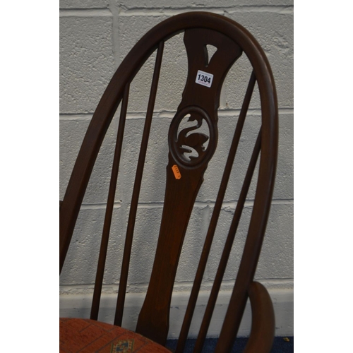 1304 - A DARK ERCOL ASH SWAN BACK WINDSOR ROCKING CHAIR with a removable seat pad