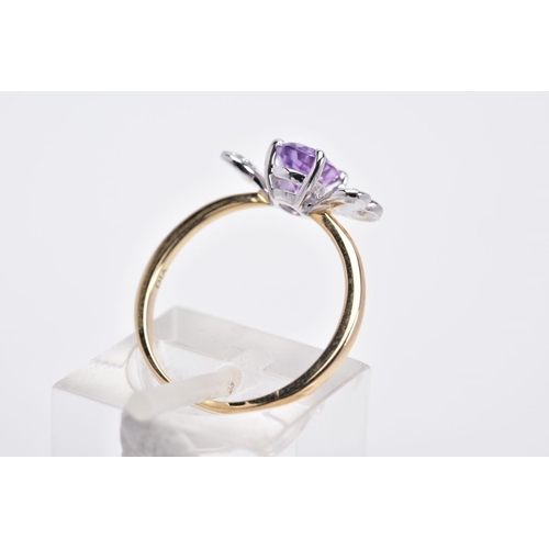 38 - A 9CT GOLD AMETHYST AND DIAMOND RING, designed with a claw set, oval cut amethyst, with heart shaped... 