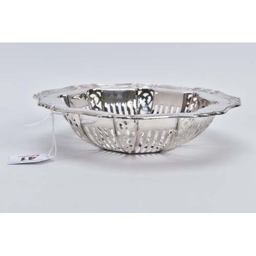 41 - A BARBARA CATTLE SILVER DISH, the bowl of openwork panels and scroll design, with a wavey detailed t... 