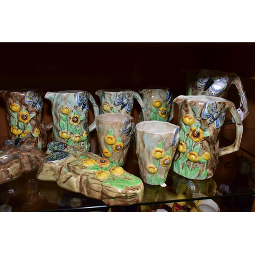 417 - FOURTEEN PIECES OF RADFORD POTTERY BUTTERFLY WARE, comprising eight jugs, tallest height 22cm, two w... 