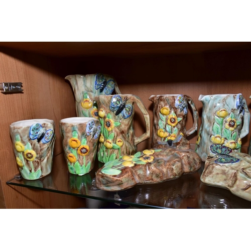 417 - FOURTEEN PIECES OF RADFORD POTTERY BUTTERFLY WARE, comprising eight jugs, tallest height 22cm, two w... 