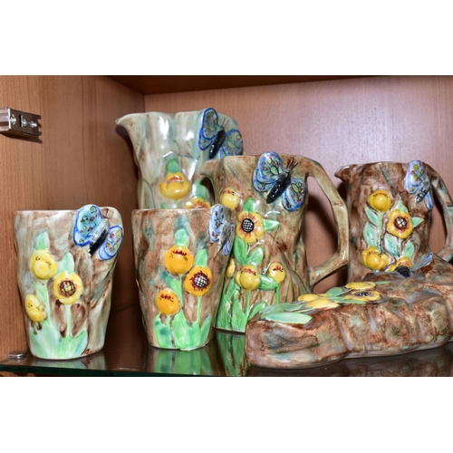 417 - FOURTEEN PIECES OF RADFORD POTTERY BUTTERFLY WARE, comprising eight jugs, tallest height 22cm, two w... 