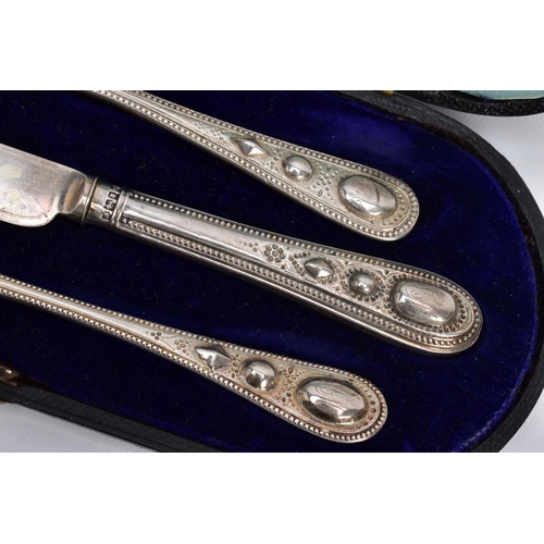 42 - A CASED SET OF SILVER CUTLERY, to include a three-piece set of floral  engraved beaded edge pattern ... 