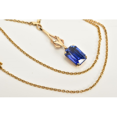 51 - A YELLOW METAL SAPPHIRE PENDANT NECKLACE, designed with an openwork drop detailed pendant with a cla... 