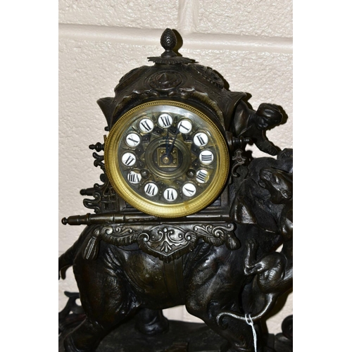 596 - A LATE 19TH CENTURY BRONZED METAL MANTEL CLOCK, the ornate case modelled as an Indian elephant with ... 