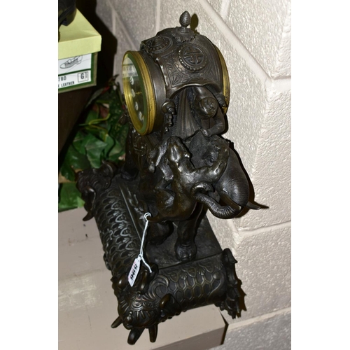 596 - A LATE 19TH CENTURY BRONZED METAL MANTEL CLOCK, the ornate case modelled as an Indian elephant with ... 