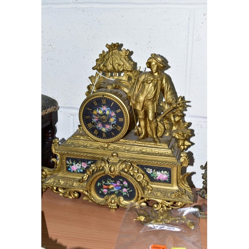 612 - A LATE 19TH CENTURY BRASS MANTEL CLOCK OF ORNATE DESIGN, enamelled Roman numerals, eight day movemen... 