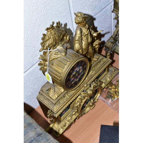 612 - A LATE 19TH CENTURY BRASS MANTEL CLOCK OF ORNATE DESIGN, enamelled Roman numerals, eight day movemen... 