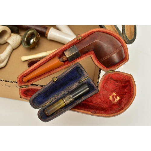 83 - A SELECTION OF SMOKING EQUIPMENT, to include a cased Meerschaum pipe, the bowl gripped by a clawed b... 