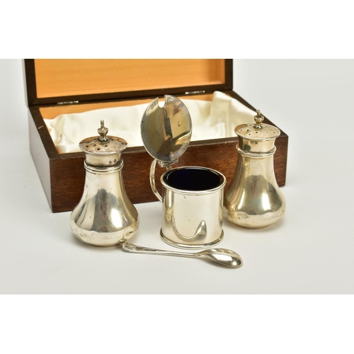 91 - A CASED THREE PIECE SET OF SILVER, to include a plain polished designed salt and pepper pot together... 