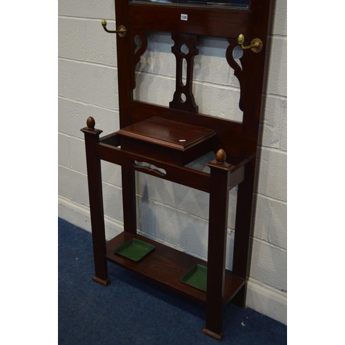 1326 - AN EARLY 20TH CENTURY MAHOGANY HALL STAND, with six brass hooks, central bevelled edge mirror, width... 