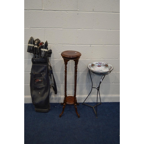 1331 - A CIRCULAR WROUGHT IRON PLANT STAND BASE, with a later ceramic wash basin, height 80cm together with... 