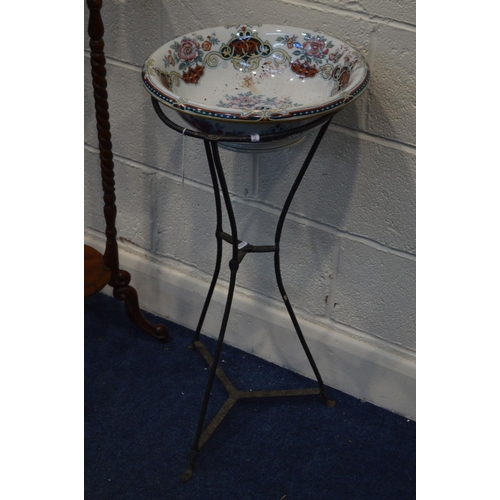 1331 - A CIRCULAR WROUGHT IRON PLANT STAND BASE, with a later ceramic wash basin, height 80cm together with... 