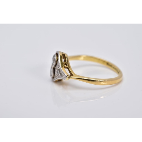 14 - AN EARLY 20TH CENTURY DIAMOND RING, of art deco style, set with two central round brilliant cut diam... 