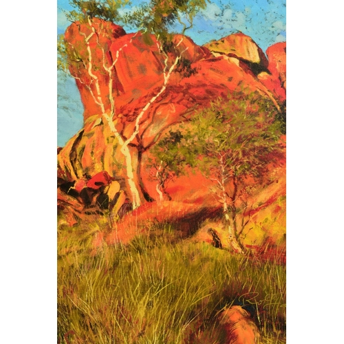 305 - ROLF HARRIS (AUSTRALIAN 1930) 'SUN ON DEVILS MARBLES' a limited edition print of the Australian outb... 