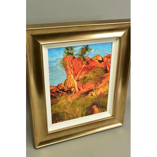 305 - ROLF HARRIS (AUSTRALIAN 1930) 'SUN ON DEVILS MARBLES' a limited edition print of the Australian outb... 