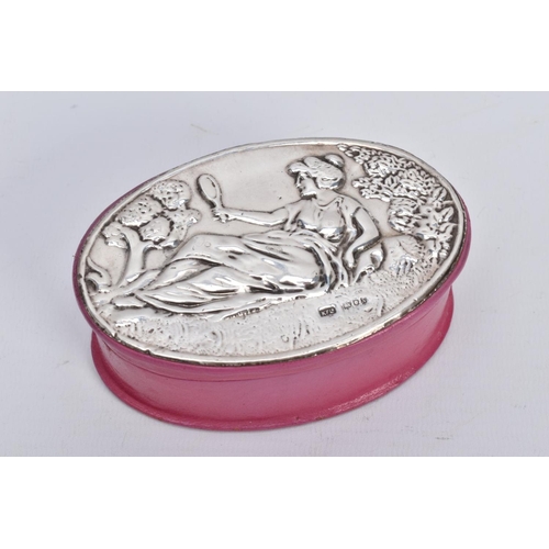 45 - A SILVER LIDDED PINK BOX, of oval form, depicting a lady holding a mirror scene to the silver lined ... 