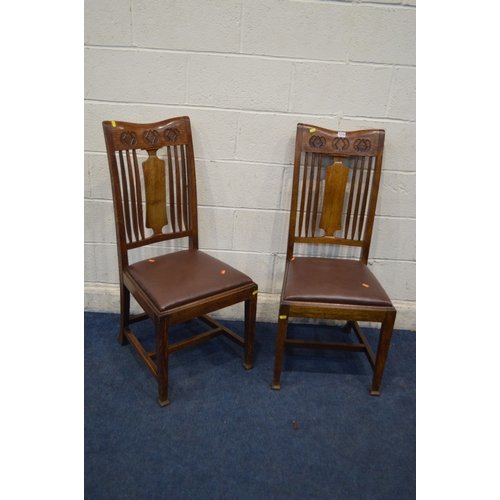 1338 - A PAIR OF EARLY 20TH CENTURY OAK ARTS AND CRAFTS CHAIRS, carved top rail , above a spindled and spla... 