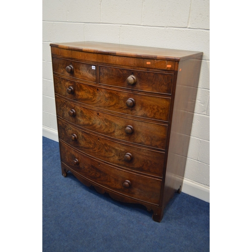 1344 - A GEORGE III FLAME MAHOGANY BOWFRONT CHEST OF TWO OVER FOUR LONG GRADUATING DRAWERS, the top with a ... 