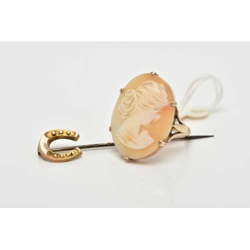 1 - A CAMEO RING AND A STICK PIN, the yellow metal, claw set cameo of oval design, depicting a lady in p... 