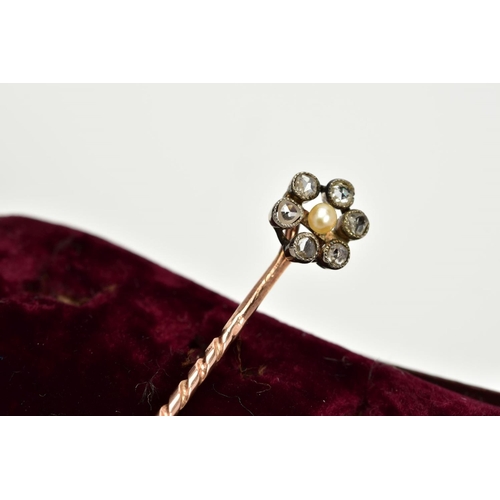 10 - A DIAMOND AND SEED PEARL STICK PIN, the rose coloured metal of flower design set with a central seed... 