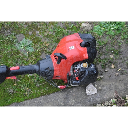 1003 - AN UNBRANDED PETROL STRIMMER (engine pulls freely but hasn't been started)