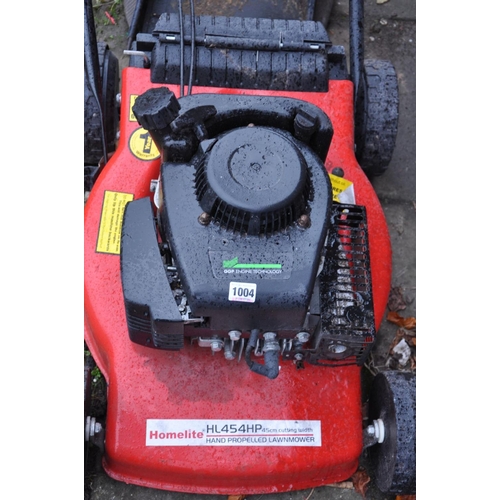 1004 - A HOMELITE PETROL LAWN MOWER with grass box (engine pulls freely but hasn't been started)