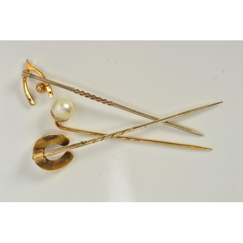 11 - THREE YELLOW METAL PEARL DETAILED STICK PINS, the first designed with a single cultured pearl, stamp... 