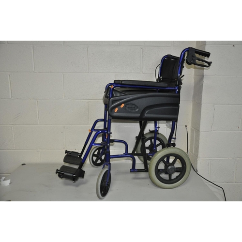 1120 - AN INVA-CARE WHEEL CHAIR with seat pad and two foot rests