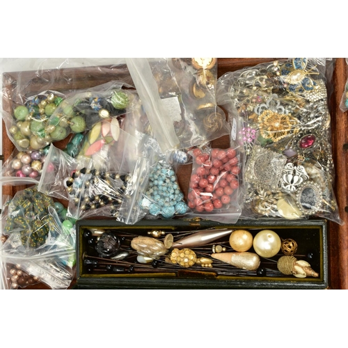 113 - THREE TRAYS OF ITEMS, to include two wooden handled trays with various bags of vintage buttons and b... 