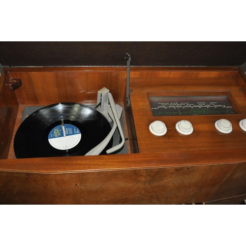 1143 - A DECCA MODEL 95 GRAMOPHONE in walnut case with a working Monarch turntable and a AM/FM/SW radio (ne... 