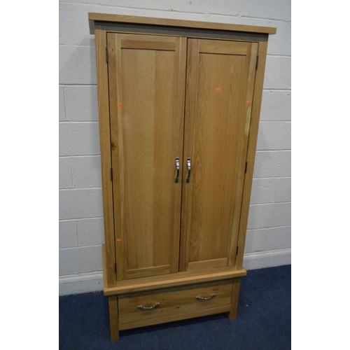 1201 - AN OAK FOUR PIECE BEDROOM SUITE, comprising a two door wardrobe with a single drawer, width 90cm x d... 