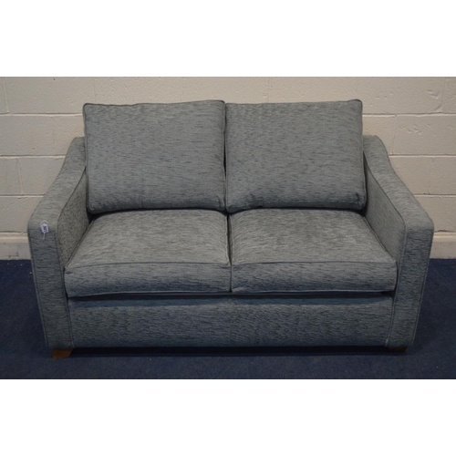 1203 - A GREY UPHOLSTERED TWO SEATER SOFA BED